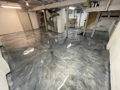 Metallic epoxy floor with blue and silver movement — Hardcore Epoxy Detroit