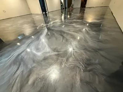 Metallic pigment epoxy being manipulated during install