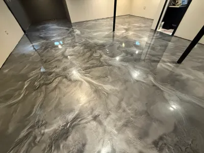 Completed metallic epoxy floor with marbled color movement